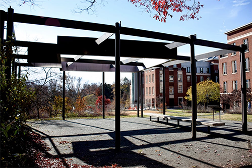 The Kitty Foster Memorial — the memorial is a metal structure which casts a shadow representative of what Foster's home looked like. 