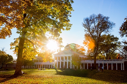 View of a UVA Pavilion and Lawn with the sunlight shining through the trees
