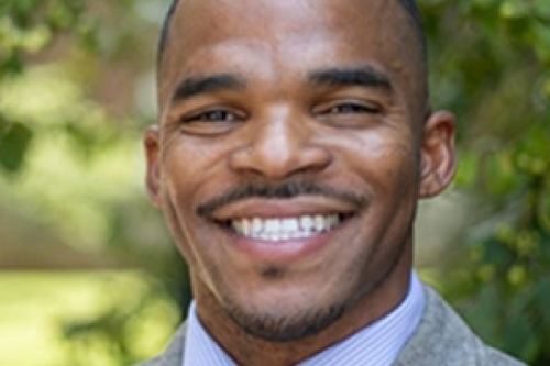 Head shot of Terry Allen smiling at camera