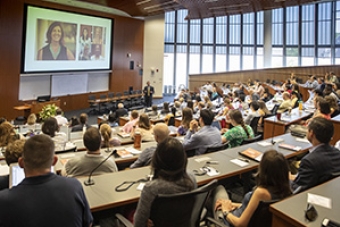 Conference with people sitting in a lecture hall